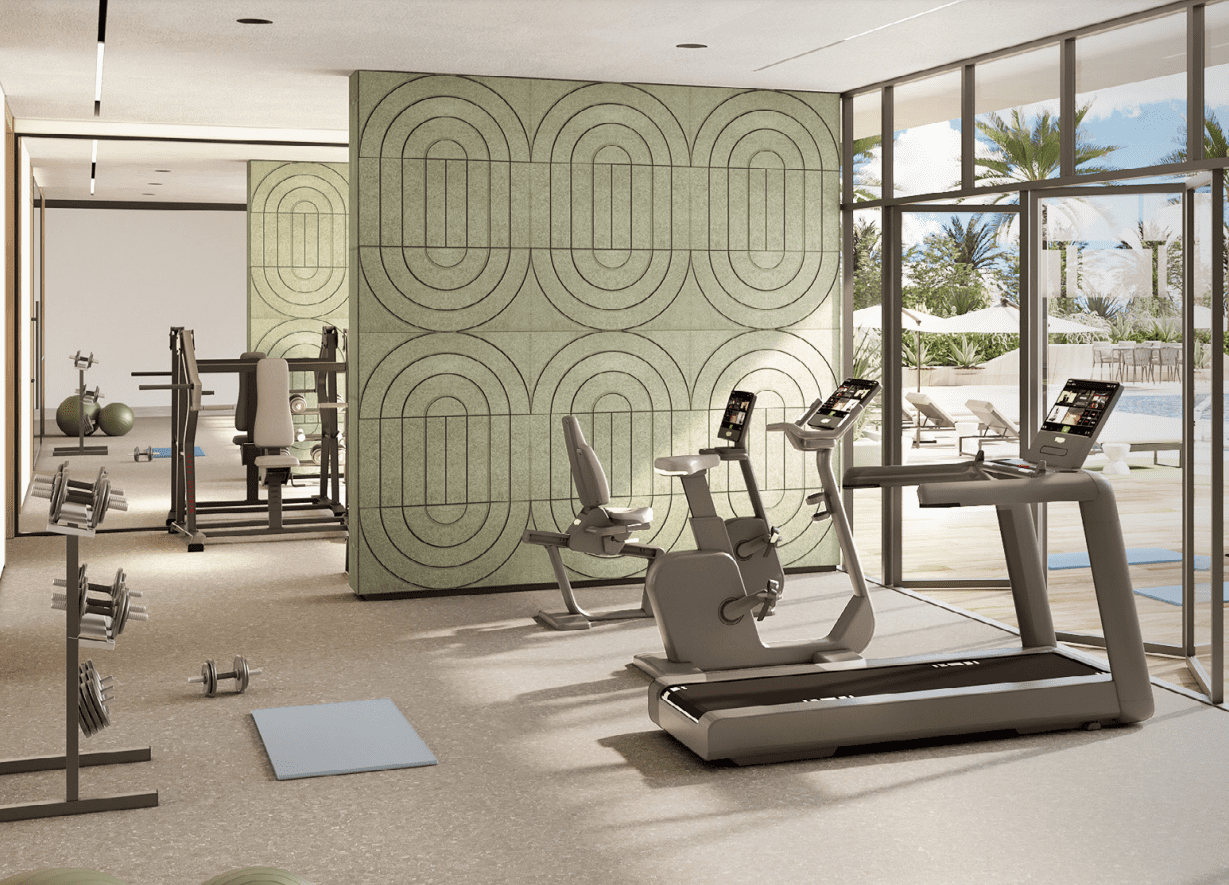 State-of-the-art gym at Roma Residences, equipped with modern fitness equipment, large windows with a pool view, and a serene ambiance.