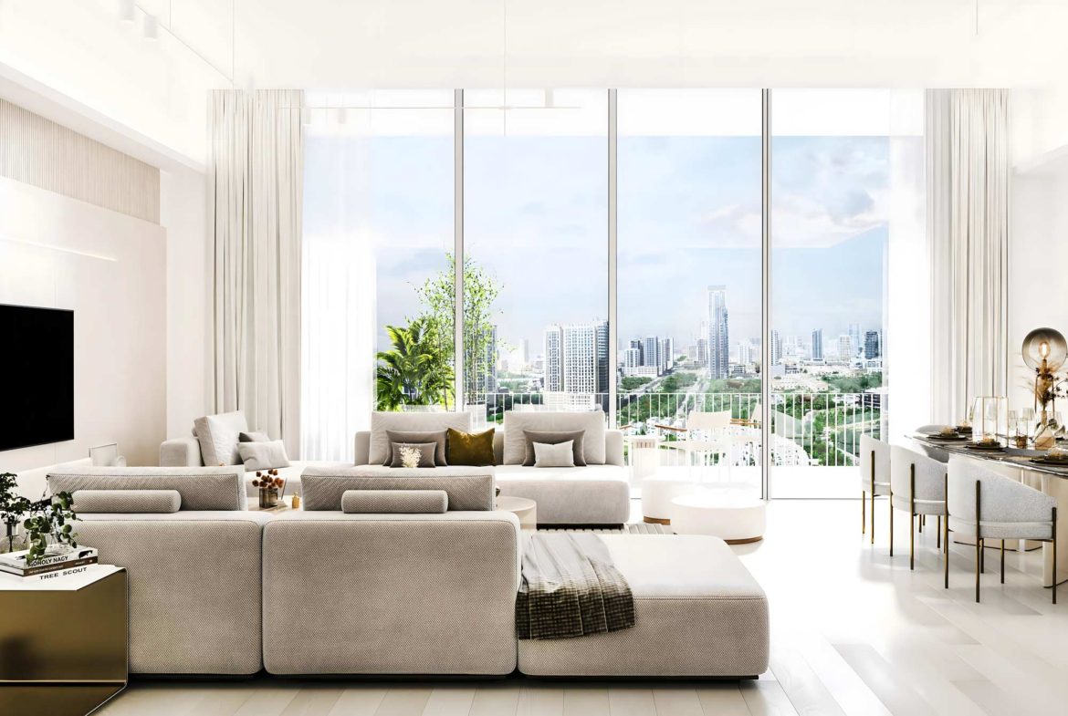 Spacious and elegantly designed living room in Luma Park Views with floor-to-ceiling windows offering panoramic views of the Dubai skyline