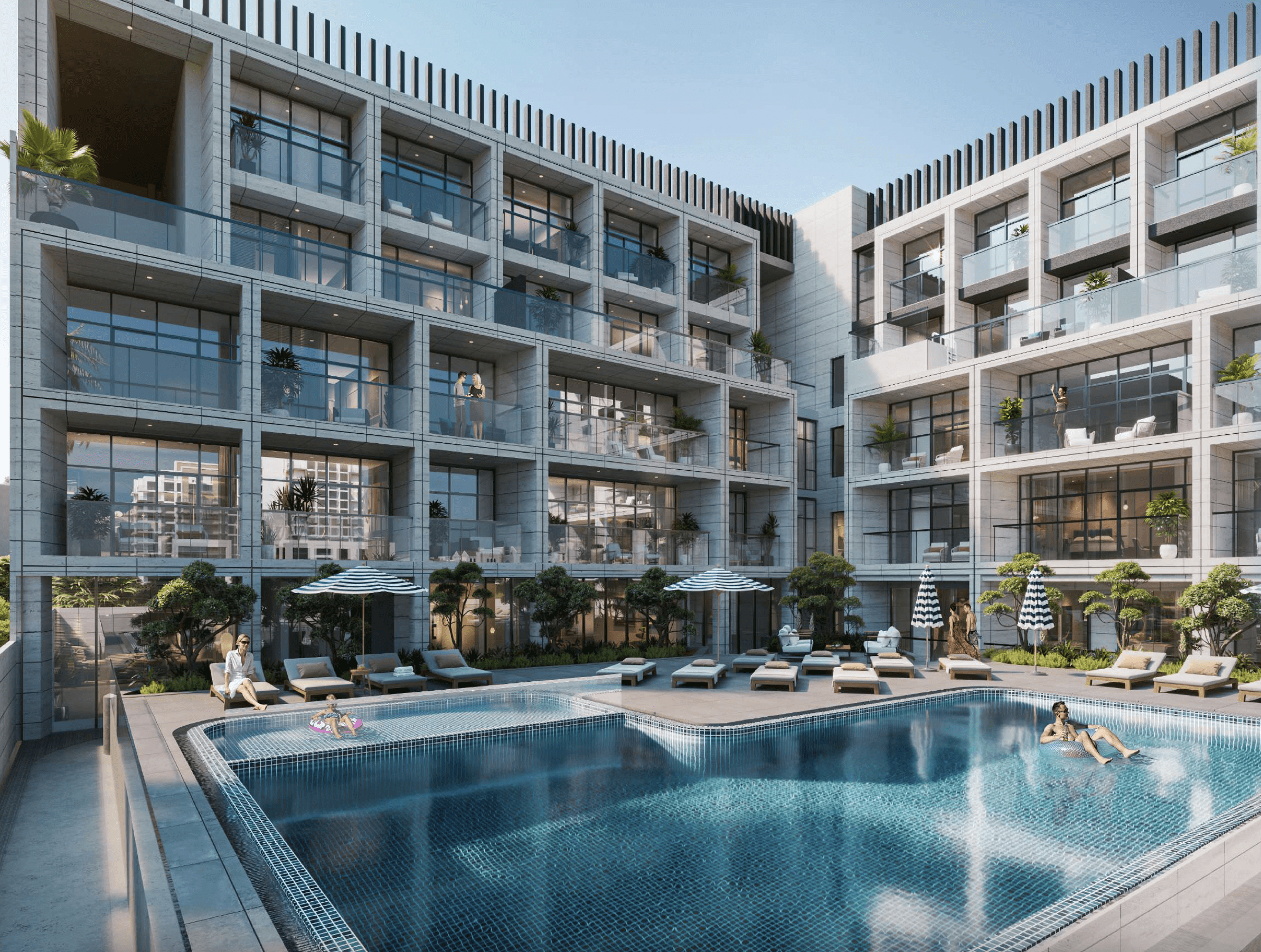 Elegant outdoor swimming pool with lounge chairs and modern building facade at Cubix Residences, Jumeirah Village Circle.